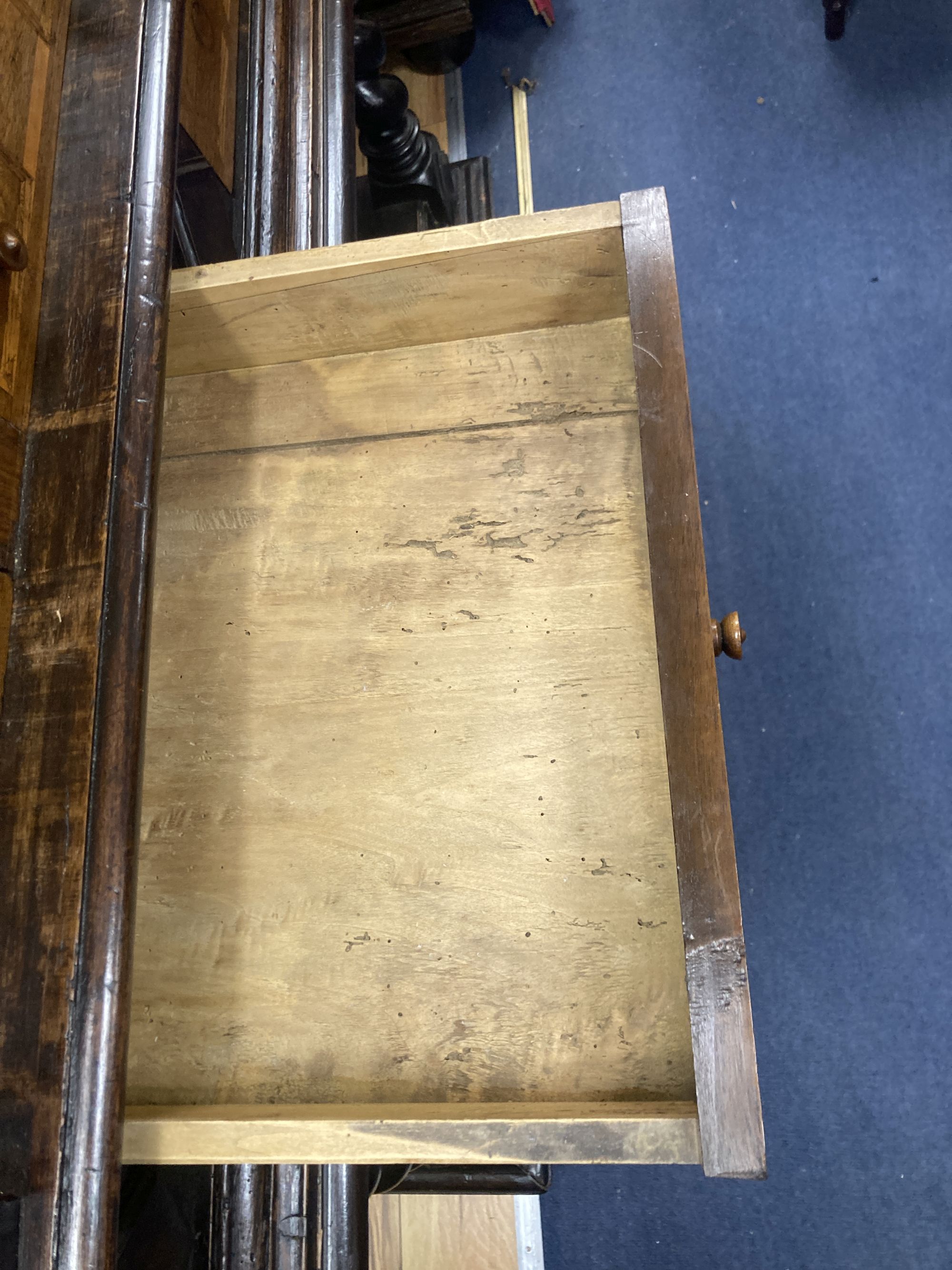 An early 19th century Dutch ebonised parquetry inlaid walnut cabinet on stand, width 136cm, depth 60cm, height 171cm